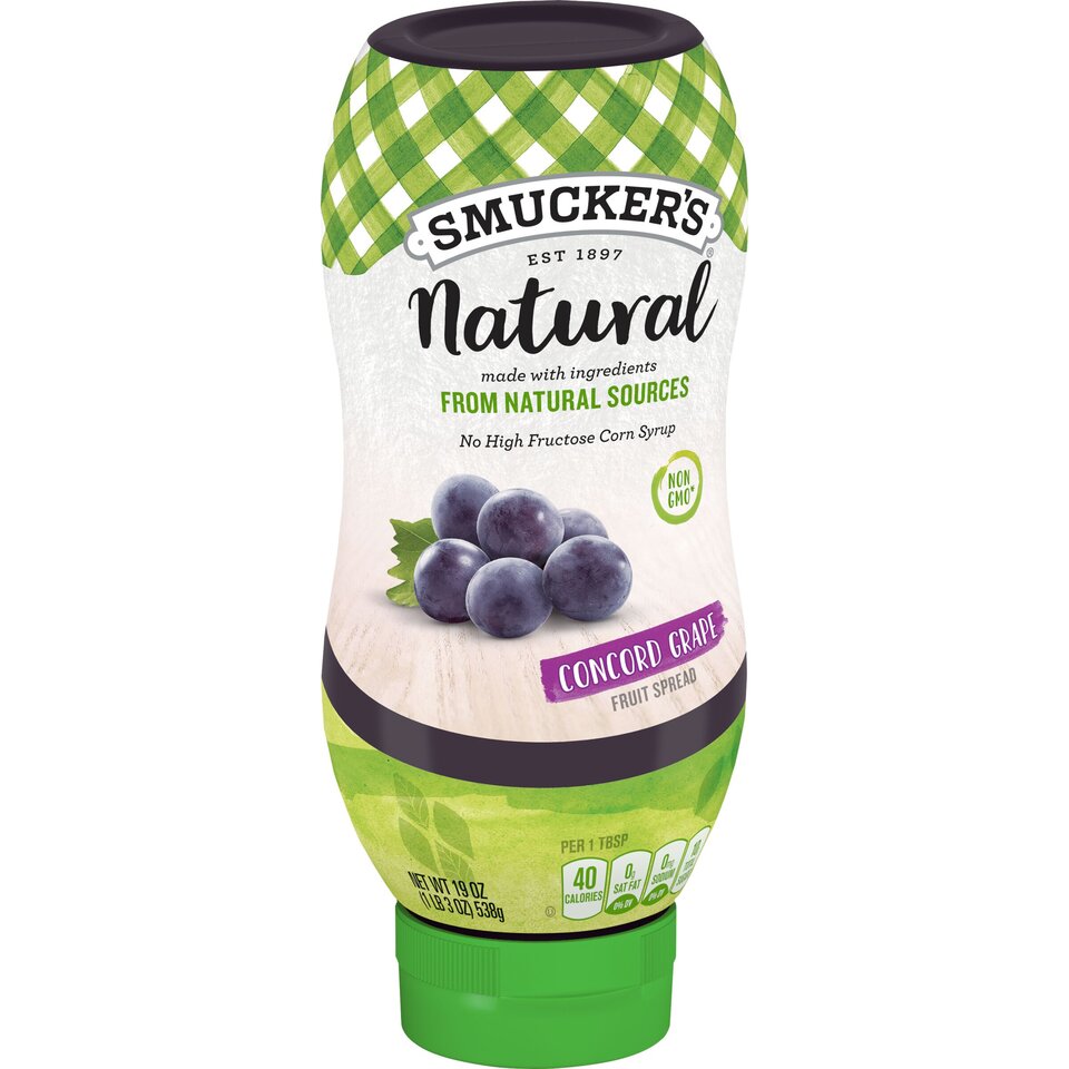 Smucker's® Natural Concord Grape Squeezable Fruit Spread front left with packaging