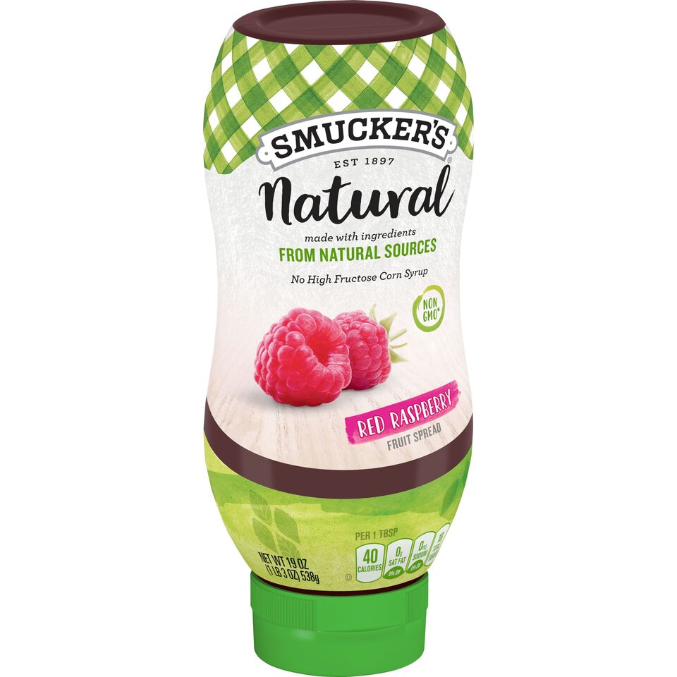 Smucker's® Natural Red Raspberry Squeezable Fruit Spread front left with packaging